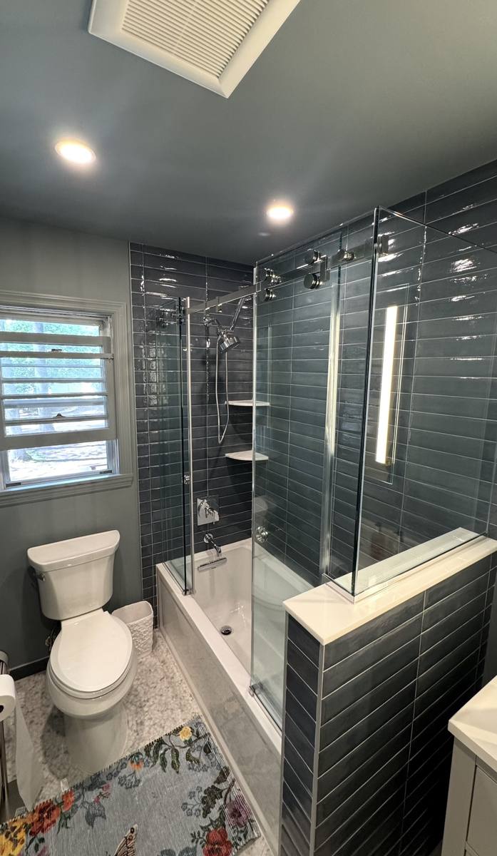 Frameless single sliding shower door with chrome hardware